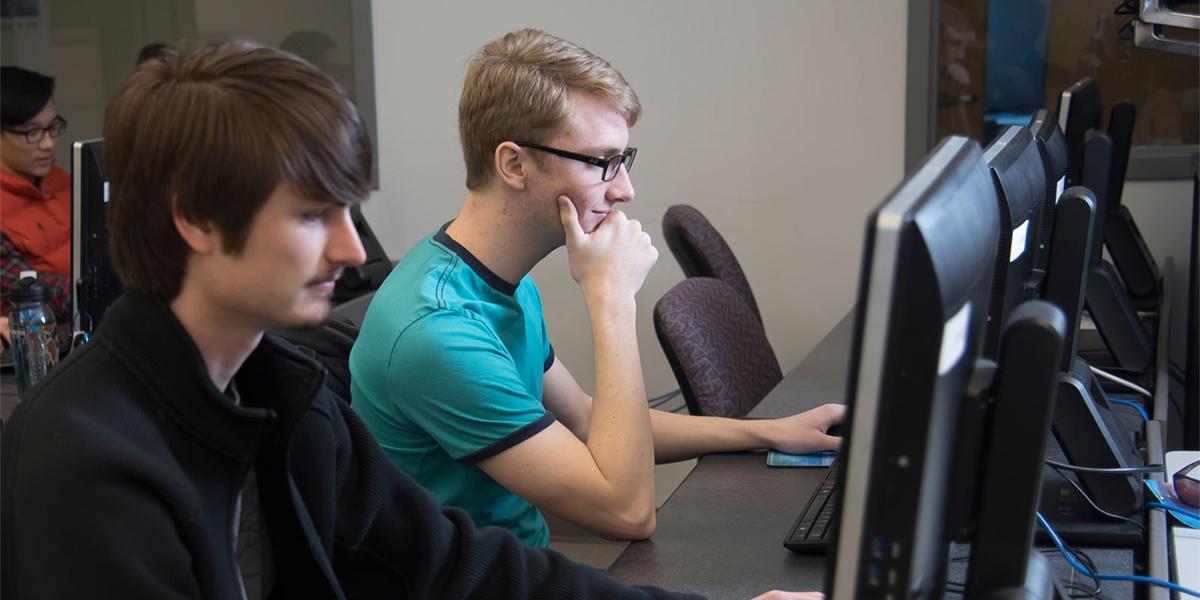 Students at computers in programming class